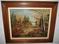 Frontal image of the framed oil painting showing the autumn forest landscape and wood frame.