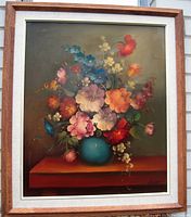 Frontal view of the framed floral still life oil painting on canvas by Michael.