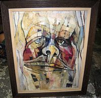 Full-frontal shot showing entire framed abstract face oil painting