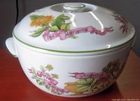 Side view of the Royal Worcester 10" lidded serving bowl showing botanical illustrations and side handle