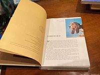 Photo showing the foreword page of the 1958 National Geographic Book of Dogs, illustrating inside pages with text and a photo of a dog.