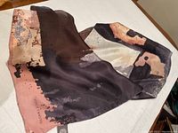 Full view of the Vince Camuto silk scarf showing the abstract pattern and overall size