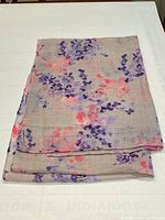 Folded scarf showing overall color and floral pattern