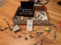 Overall view of trays showing rings, necklaces, earrings and pendants