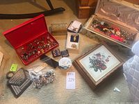 Overview of all boxes and loose jewelry on carpet