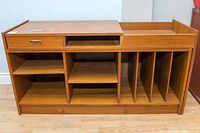 Full front view of the cabinet showing overall structure, compartments and removable glass top.