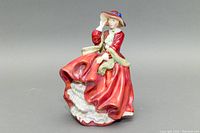 Front view of Royal Doulton porcelain figurine showing detailed face, dress, and hat