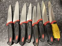 Photo of the blades and handles showing wear and size variety.
