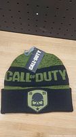 Front view of the Call of Duty winter hat showing brand tag and skull patch on cuff.