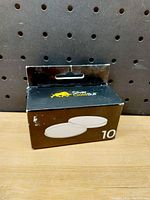 Box showing Silver Gold Bull brand and quantity of 10 coin capsules for 38mm coins.