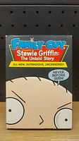 Front cover of DVD case featuring Stewie Griffin cartoon character with title and promotional text.