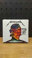 Front view of the shrink-wrapped Metallica Hardwired...To Self-Destruct 2 CD set showing album art and band logo.