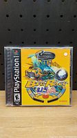 Front cover of PlayStation 1 game Pro Pinball Big Race USA displaying colorful artwork and logo on yellow background.