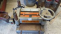 Front view showing feed table, cutter head, handwheel and on/off switch