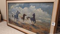 Full view of framed painting showing running horses and outer frame