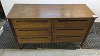 Front view of six-drawer wooden dresser