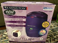 Original retail box of the Remington Paraffin Spa wax warmer showing product branding and features.