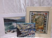 Three art prints with ocean waves, Gloucester harbor, and Ireland map subject matter, showing overall condition and style.