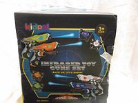 Box front showing four infrared toy guns with colorful design and Kidpal branding, labelled as Upgrade Version for ages 3+.