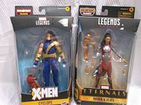 Front view of boxed Cyclops and Makkari Marvel Legends figures showing packaging and characters.