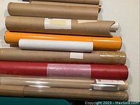Top view of eight storage tubes showing varied colors and some tape markings