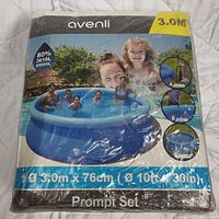 Front view of Avenli pool packaging showing image of pool in use, dimensions as 3.0m x 76cm, water capacity 3618L, sealed packaging.