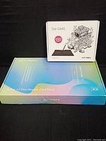 Two factory-sealed XP-PEN graphics tablets box: Artist 12 Pen Display and Star G640, displayed on a black backdrop.