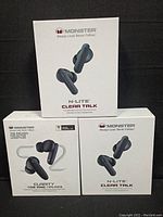 Three boxed sets of Monster wireless in-ear headphones. Two are N-Lite Clear Talk model, one is Clarity 108 ANC Airlinks. Boxes show branding, model names, and image of headphones.