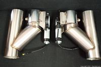 Two stainless steel Y-shaped electronic exhaust cutout valves with mounted electric motor actuators side by side, showing full length and details of welding and wiring.