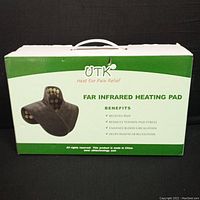 Box for UTK Far Infrared Heating Pad with benefits listed: relieves pain, reduces tension and stress, enhances blood circulation, helps muscular relaxation.