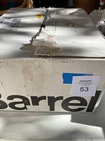 Closed cardboard box labeled 'Barrel' with lot sticker '53'