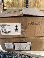 Two cardboard boxes, one labeled Anchor Hocking with product and quantity info (Qty 36)