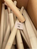 Box filled with rolled vintage posters, some with age discoloration to paper.