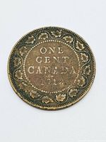 Reverse side of the 1912 Canada one cent coin displaying the denomination, country, year and wreath design.