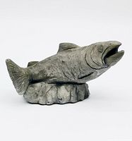 Front view of the salmon sculpture showing the mouth open and textured details