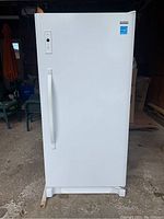 Front view of closed freezer showing white exterior and handle