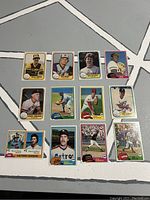 Top view of 12 assorted 1981 baseball cards showing front player images and design