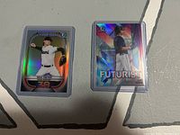 Front view of the Max Meyer Top 100 card and Zac Veen Futurist card with holographic and prism shine effects.