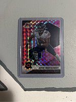 Front side of 2021 David Montgomery Pink Mosaic football card showing holographic pink mosaic pattern and player image.
