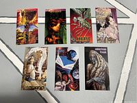 Seven DC Vertigo comic trading cards laid out in two rows showing front art featuring various comic characters and titles.