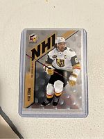 Front of the 2022 Upper Deck Mark Stone HoloGrFx hockey card showing player in action and branding.
