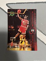 Front side of the card showing Michael Jordan in action wearing his Chicago Bulls uniform mid-jump, with text indicating 1st Championship 1991 and card numbering information.