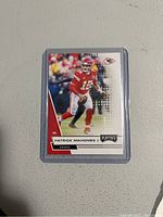 Front side of the 2020 Panini Playoff Patrick Mahomes II football card showing the player in action and card design.