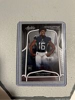 Front of the Treylon Burks 2022 Absolute Football Introductions Rookie Card in protective sleeve.