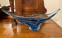 Front view of the blue glass decorative bowl showing its shape and color pattern.