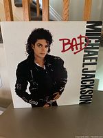 Front cover of Michael Jackson's Bad vinyl record showing artist and title in very good condition.