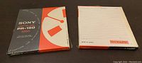 Front view of two sealed Sony PR-150 reel to reel recording tapes.