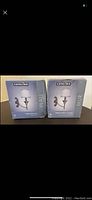 Two boxed Catalina wall lamps labeled 'Catalina Wall Mur' showing new condition boxes.