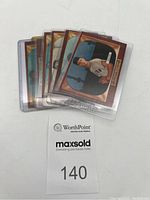 Six 1955 Bowman MLB baseball cards layered together in protective sleeves showing edges and front of the top card.