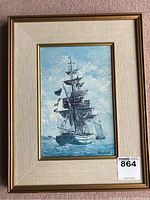 Full view of framed print showing the ship The Inca in sea with blue sky and ocean.
